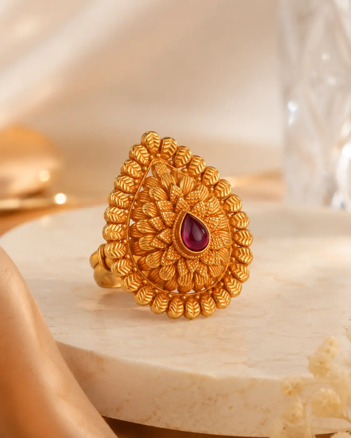 Indriya antique gold ring with ruby centre stone