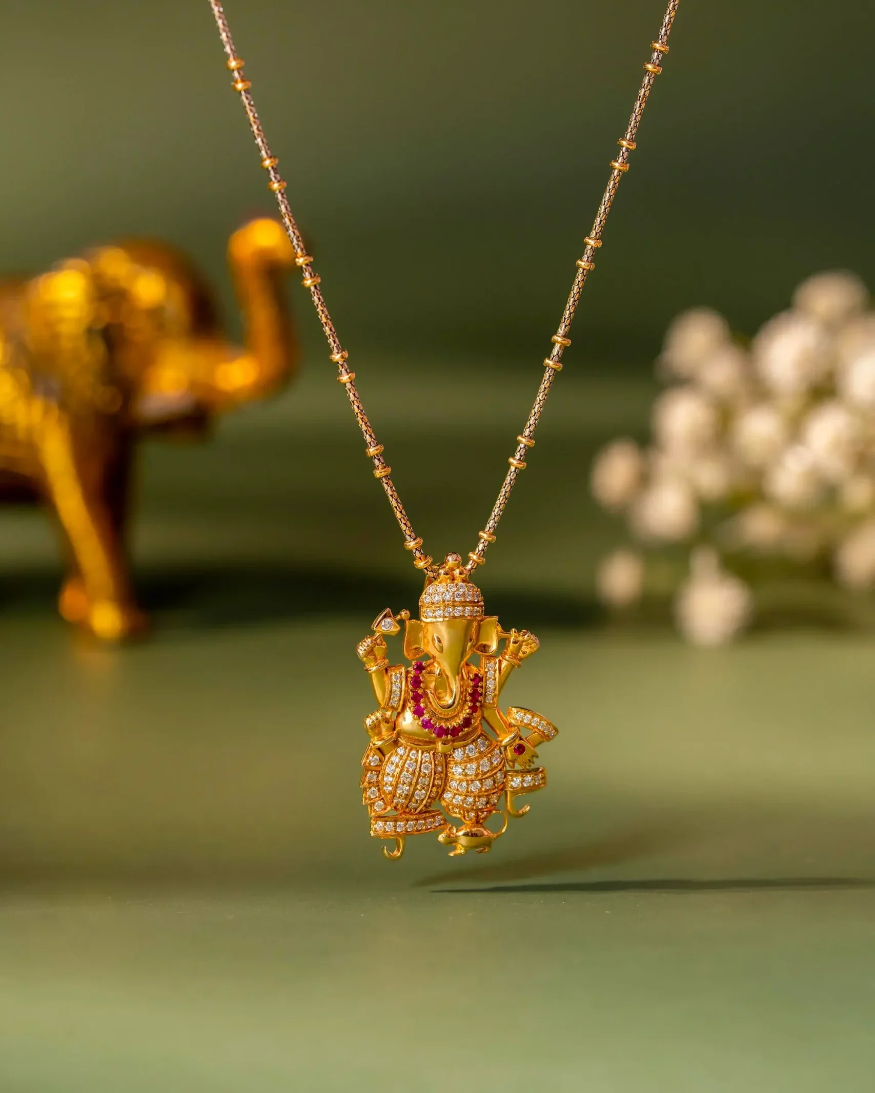 Prena's gold and diamond Ganpati pendant necklace